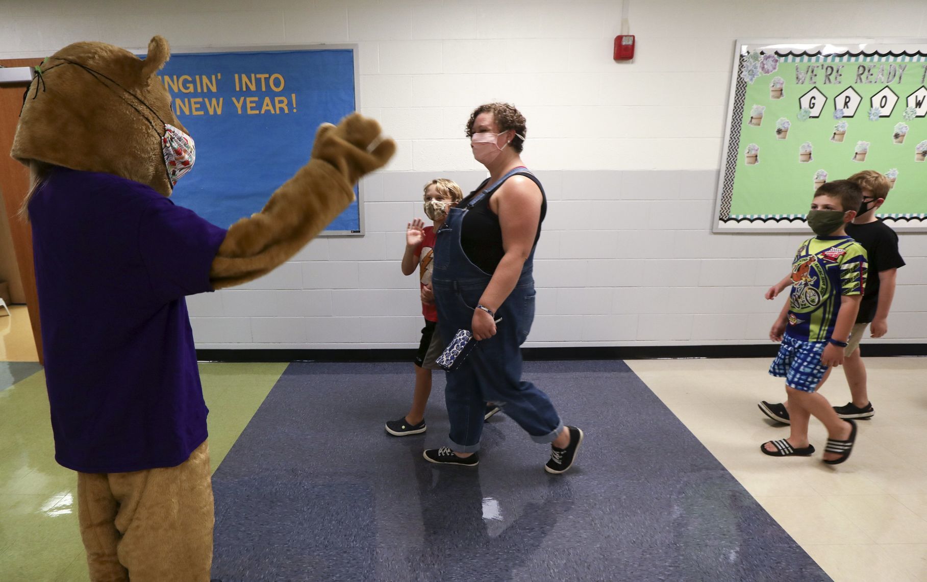 Waving to the Cougar mascot during open house